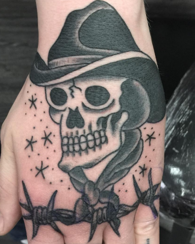 Chip Baskin tattoo skull cowboy hand old school