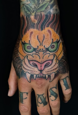 Dave Regan tattoo lion hand
